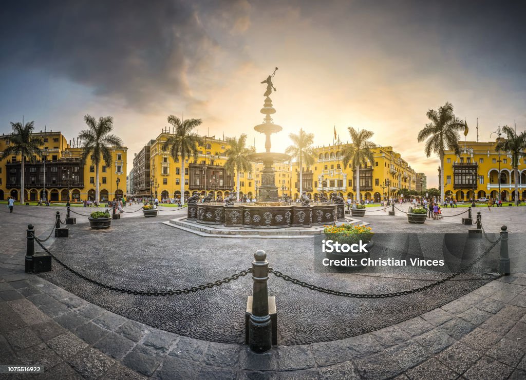 Antique iron pool of the main square of Lima, Peru. View of the sunset of the antique iron pool of the main square of Lima, Peru. Lima - Peru Stock Photo