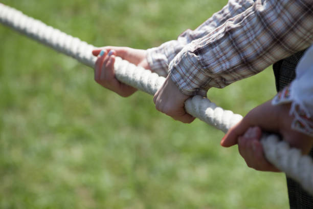 istock Playing tug of war 1075525996
