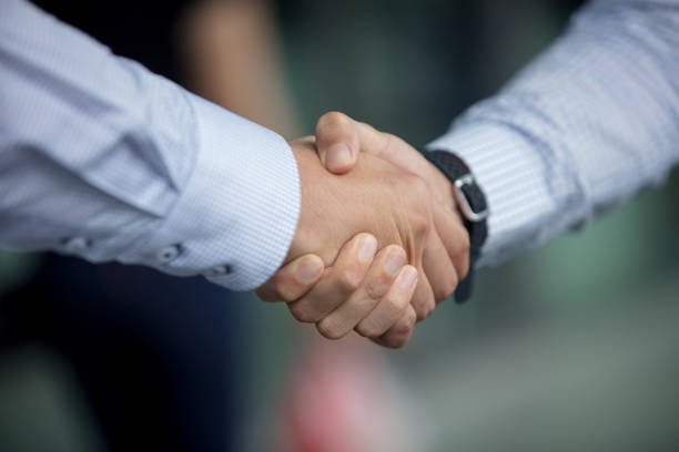 istock Business people shaking hands 1075536844