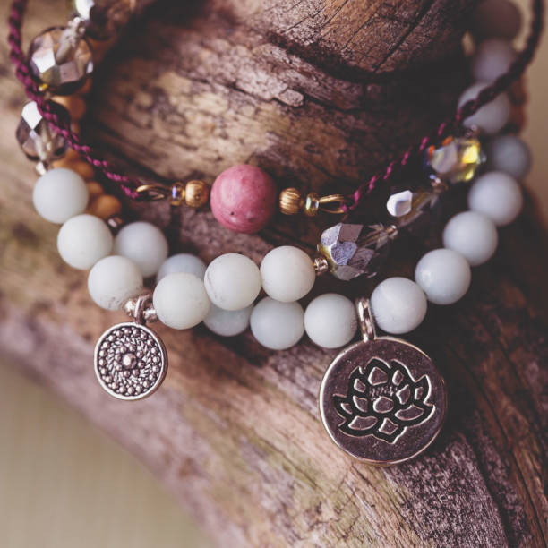 Three natural mineral stone beads bracelet on wooden background