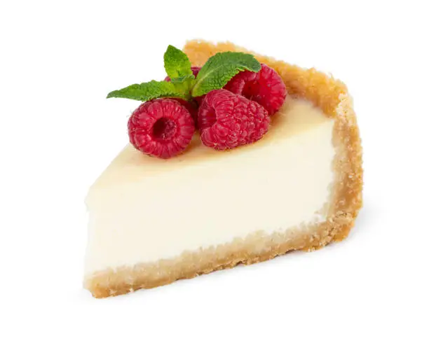 Photo of Piece of cheesecake with raspberries and mint isolated on white