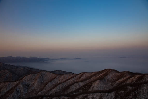 Pre-sunrise dawn from the top of Chiak Mountain, covered in winter snow