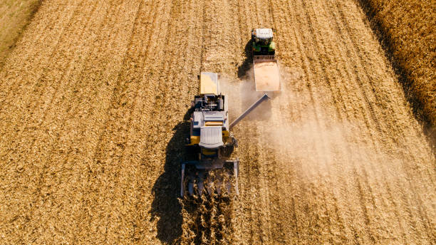 istock Drone view of agriculture machinery working the fields 1075551110