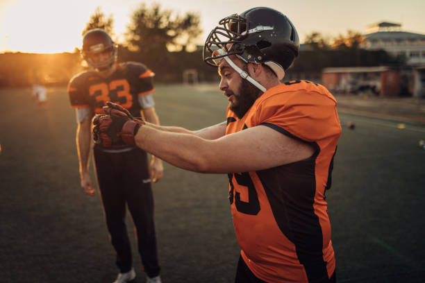 istock Football Players On A Field 1075551146