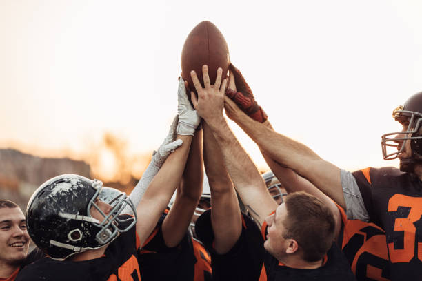 istock Football Players Huddling 1075552524