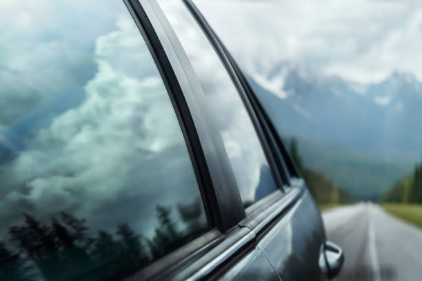 Beautiful landscape from car window on mountain road. Summer traveling by car