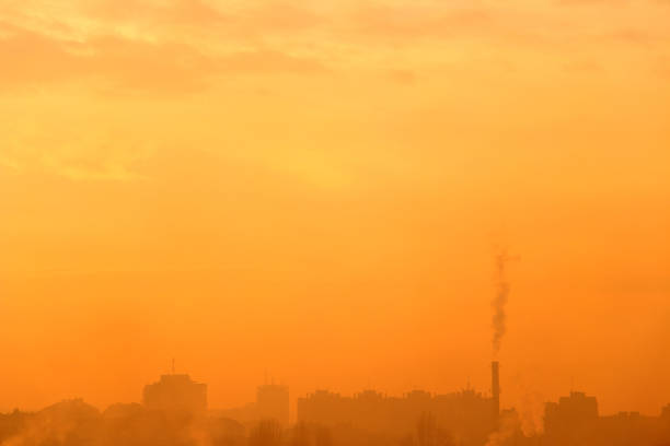 Smoggy foggy winter afternoon in a city. Sky and cityscape. Ideal as a background.
