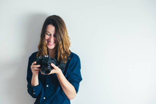 istock Brunette girl with photo camera 1075572004