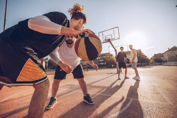 istock Men playing street basketball 1075580242