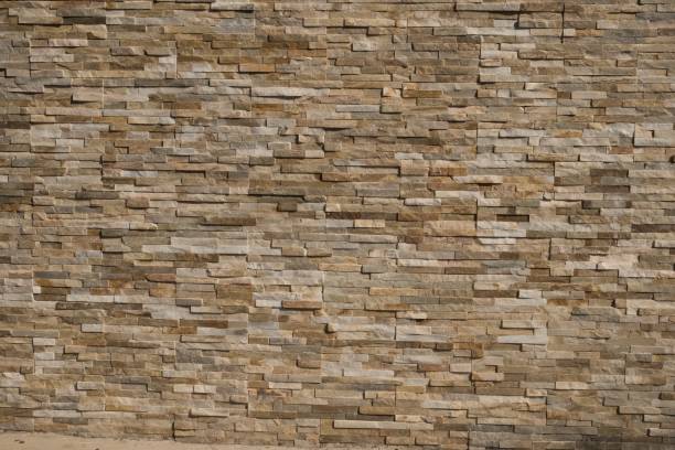 istock Stone Wall background from modern building contruction facade 1075581828