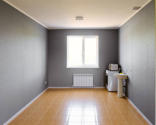 istock Not equipped empty kitchen room with bright window in new apartment building 1075583966