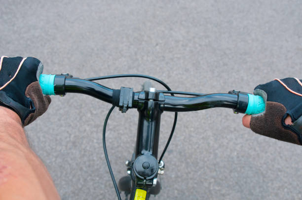istock Cycler riding his bicycle on a asphalt road 1075585782