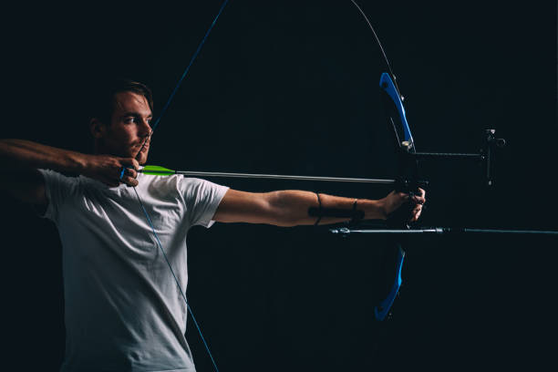 istock Young archer with the bow and arrow 1075589374