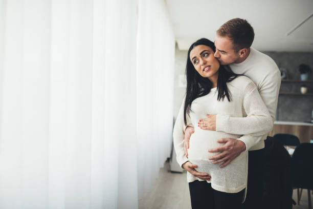 istock Parents touching pregnant belly 1075591024