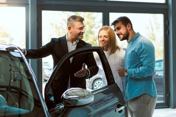 istock Buying car in salon 1075596510