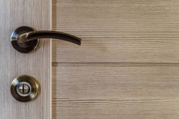 istock Interroom laminated door with door knob and lock close-up 1075596910