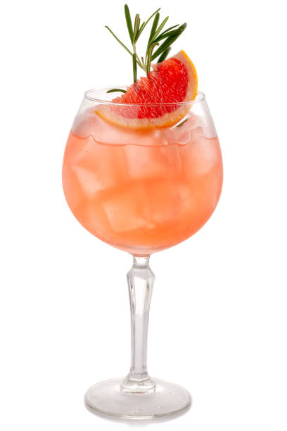 istock Alcohol coctkail with grapefruit and spices isolated on white 1075599010