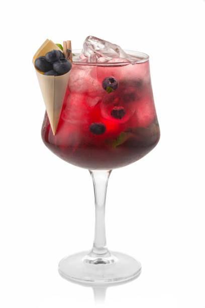 istock Alcohol coctkail with fresh blueberry and spices isolated on white 1075599012