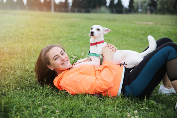 istock Young woman with dog 1075600744