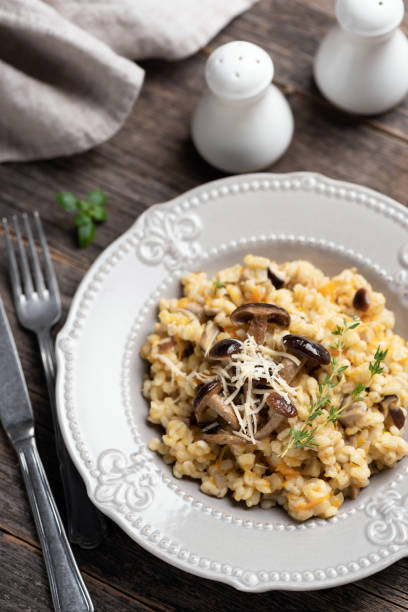 istock Barley mushroom risotto on plate 1075617402