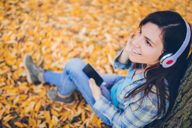 istock Listening to music in a park 1075620568
