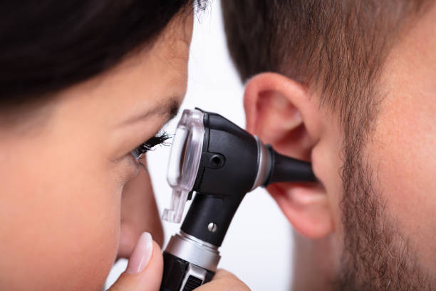 istock Doctor Examining Male Patient's Ear 1075626146