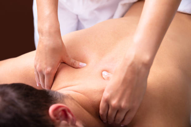 istock Therapist Giving Back Massage To Man 1075627810