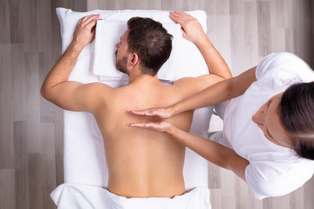 istock Man Receiving Shoulder Massage 1075627816