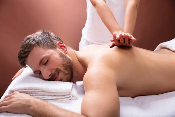 istock Therapist Giving Back Massage To Man 1075627820