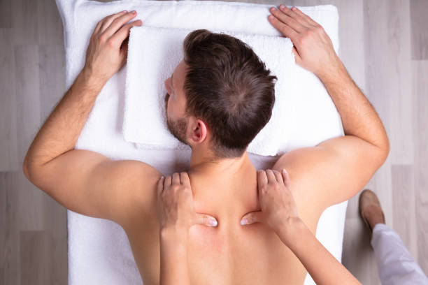 istock Man Receiving Shoulder Massage 1075627824