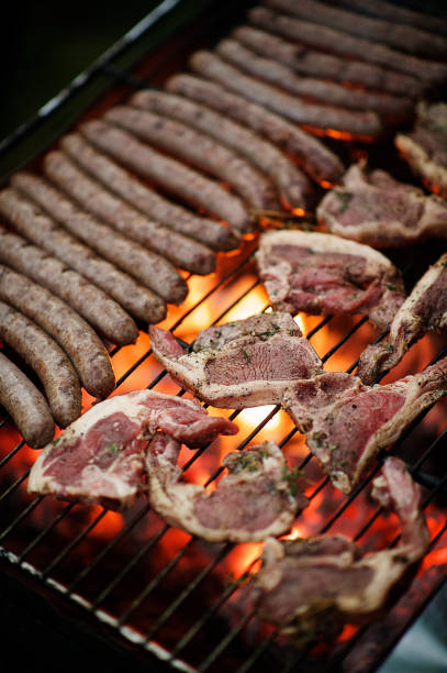 Braaivleis A typical South African tradition of braai barbecue with lamb chops and boerewors sausage Cape Town South Africa south african braai stock pictures, royalty-free photos & images