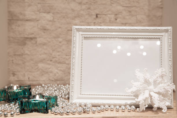 istock Christmas greeting card background, mock up. Turquoise star candlesticks, glittering silver beads and white glittering snowflake. 1075632748