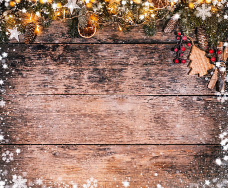 Decorative Christmas rustic background on wooden planks. Celebration and holiday concept. Free space for text.