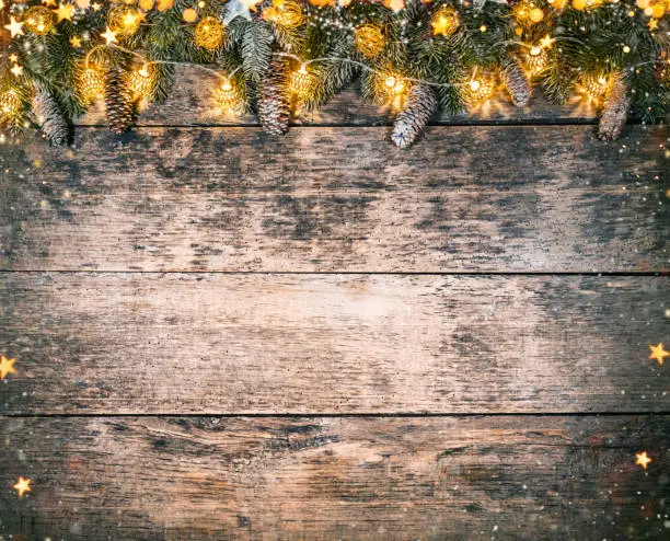 Decorative Christmas rustic background on wooden planks. Celebration and holiday concept. Free space for text.