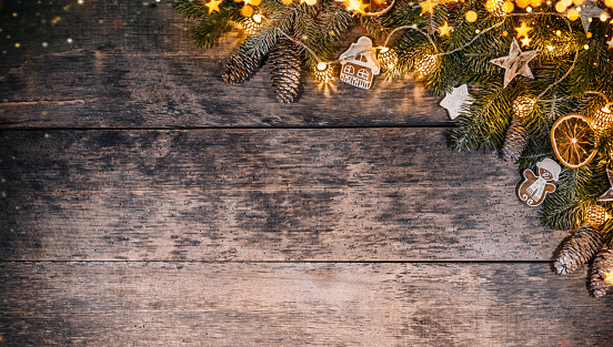 Decorative Christmas rustic background on wooden planks. Celebration and holiday concept. Free space for text.