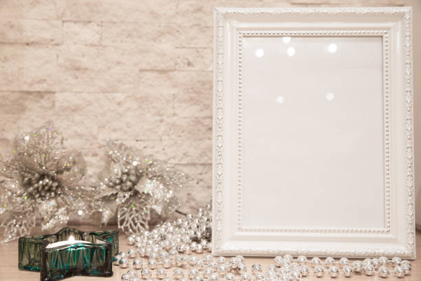 istock Christmas greeting card background, mock up. Turquoise star candlesticks, glittering silver snowflakes on brick wall background. Space for text. 1075650898