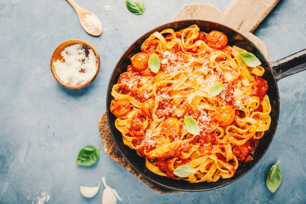 istock Pasta with tomato sauce and parmesan 1075659532