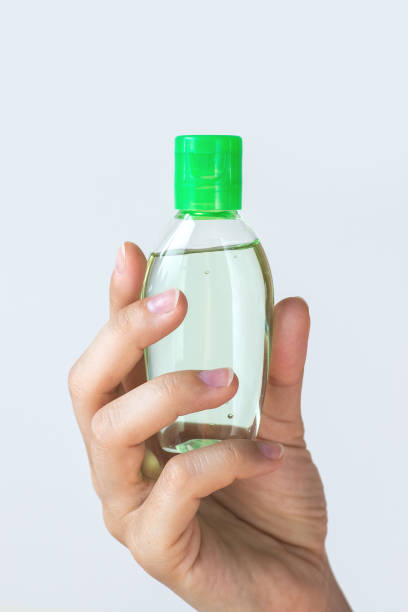 istock Hand with a small bottle of hand sanitizer 1075663136