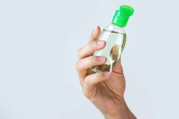 istock Hand with a small bottle of hand sanitizer 1075663148