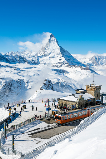 People at Gornergrat railway station (3.089 m) with Matterhorn peak above Zermatt town in Mattertal, Valais canton, Switzerland, in winter. Taken by Sony a7R II, 42 Mpix.