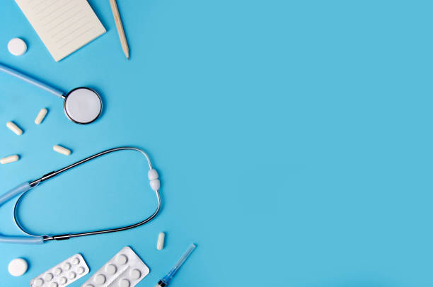 istock Medical concept blue background. Doctor's desk with instruments. Copy space. 1075686888