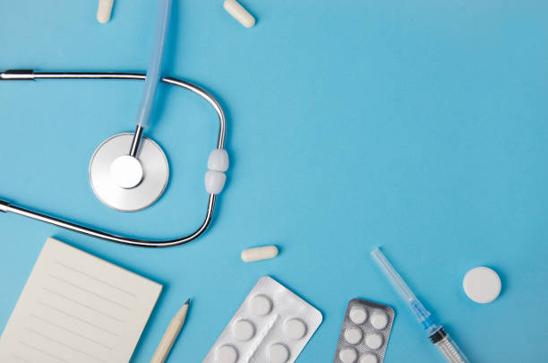 istock Medical concept blue background. Doctor's desk with instruments. Copy space. 1075688088
