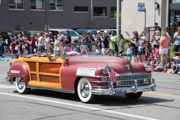 Naperville, Illinois, United States-May 29,2017:WWII army veteran in vintage Chrysler Town and Country driving during the Memorial Day parade in Naperville, Illinois
