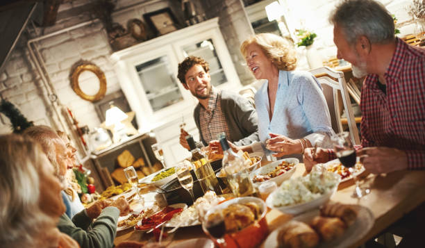 istock Family having Christmas dinner. 1075698490