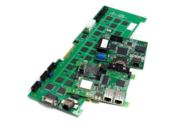 istock Set of electronic printed circuit boards with microchips and other components, angled view, isolated on white 1075709144