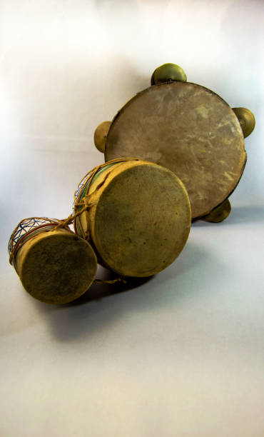 istock Ethnic instruments: drums and tambourine isolated on white background. 1075711638