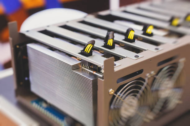 istock Close-up view of equipment for bitcoin cryptocurrency mining farm, electronic devices with fans, concept of mining technology 1075714768