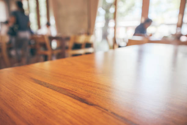 istock Restaurant interior with customer and wood table blur abstract background with bokeh light 1075733648