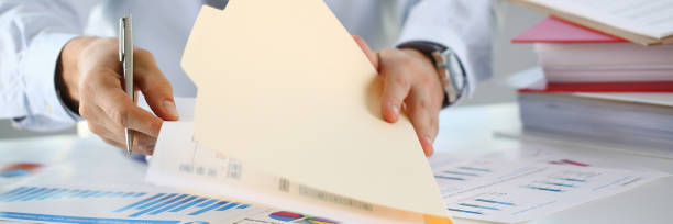 istock Male hands hold documents with financial 1075734238
