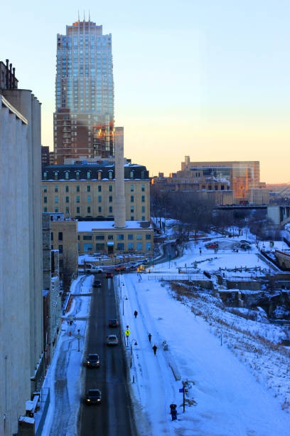 Beautiful winter morning in Minneapolis. Downtown cityscape areal view from the height on a covered by snow street. Minnesota, Midwest USA. Vertical composition.